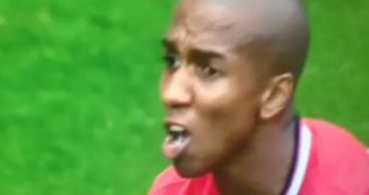 Ashley Young with a mouth full of bird poop