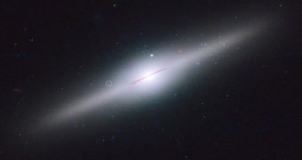 This spectacular edge-on galaxy, called ESO 243-49, is home to an intermediate-mass black hole that may have been stripped off of a cannibalized dwarf galaxy.