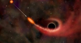 A star is pulled apart by a black hole in this artist?s impression