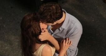 Bella (Stewart) and Edward (Pattinson) share a passionate kiss on “Breaking Dawn”