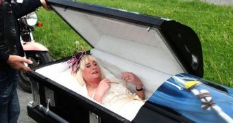 Woman arrives at her wedding in a coffin