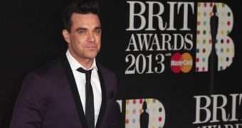 Robbie Williams looking his usual dashing self on the red carpet at the Brit Awards 2013