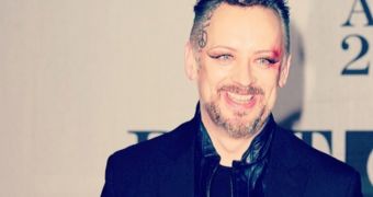 Boy George rocks bruised and bloody eye on the red carpet at the Brit Awards 2014