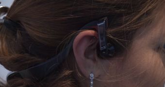 The headphones transmit sound to your years through the skin