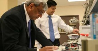 Professor Praveen Jain, Electrical and Computer Engineering, and Ph.D. candidate John Lam are seen here working on their CFL innovation