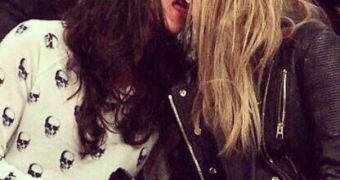 Michelle Rodriguez and Cara Delevingne at a Knicks game, obviously not paying attention to it