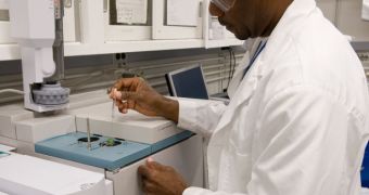 Dr. Cooper analyzes meteoritic material by injecting samples into gas chromatograph-mass spectrometer