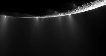 Enceladus's south polar regions are seen in this Cassini image spewing out plumes of water vapors, ice, and organic matter