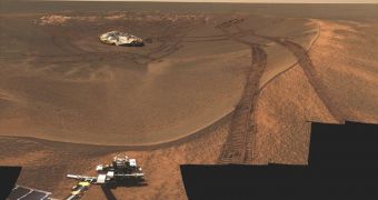 Real image of Eagle Crater, Opportunity lander, and wheel tracks, as seen by the rover in early 2004