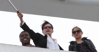 Charlie Sheen wields a machete while proclaiming he’s “free at last”