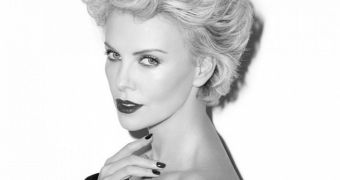 Charlize Theron strikes a sultry pose for Esquire mag