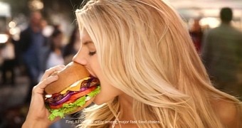 Charlotte McKinney takes a bite out of her favorite Carl's Jr. hamburger in Super Bowl 2015 ad