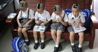 Chinese Mother Shaves ID Numbers on Quadruplets' Heads