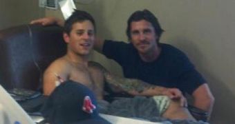 Christian Bale with Carey Rottman, who was shot in the leg during the Aurora attack
