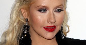 Friends say Christina Aguilera is happy with her body, proud of her curves
