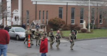 Parishioners are evacuated from the St. Rose of Lima Catholic Church, in Newtown