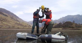 Loch nan Corr, Kintail, Scotland. Taking sediment cores from what is now the freshwater loch to measure land uplift. It was previously a marine embayment, but gradual land uplift has raised it above the level of even the highest tides