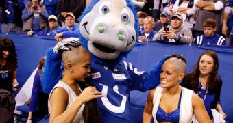 Blue admires his work after shaving cheerleaders Megan M. and Crystal Ann for charity