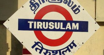 The three language (Tamil, English and Hindi) name board at the Tirusulam railway station in South India