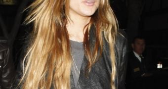 Lindsay Lohan on a cigarette break after hitting the clubs with Samantha Ronson the other night