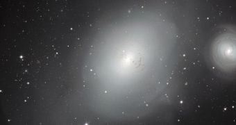 NGC 1316 (center) and the smaller NGC 1317 appear clear as daylight in this new image from the MPG/ESO 2.2-meter (7.2-foot) telescope at La Silla Observatory, in Chile