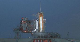 Space shuttle Discovery stands on Launch Pad 39A on Tuesday evening after the second launch attempt was called off because of a problem with a fill-and-drain valve