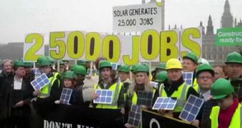 More than 500 people protested yesterday against the government's decisions of halving feed-in tariffs for solar power