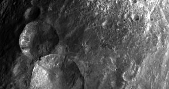 This is the "snowman" Dawn discovered on Vesta. The structure is produced by a crater cluster