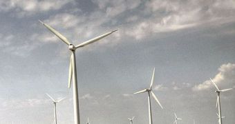 The image reflects wind power generators in Spain