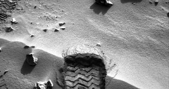 Curiosity tested the sand's softness by running over it with its wheel