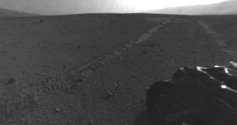 Image showing the tracks imprinted on the Martian surface by Curiosity's August 28, 2012 drive