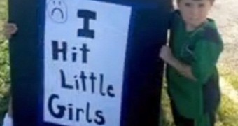 Photo shows 4-year-old holding an “I Hit Little Girls” sign