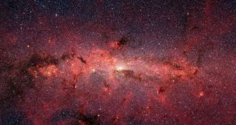 This dazzling infrared image from NASA's Spitzer Space Telescope shows hundreds of thousands of stars crowded into the swirling core of our spiral Milky Way galaxy