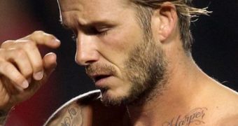 David Beckham shows off Harper tattoo on his collar bone