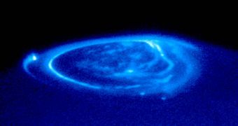 UV image of Jupiter's aurora – bright streaks and dots are caused by magnetic flux tubes connecting the planet to its largest moons