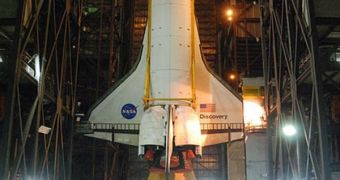 Discovery is seen here hanging vertically in the VAB, right before being attached to its external fuel tank and twin SRB