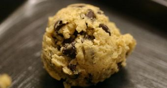 A ball of chocolate chip cookie dough ready for baking