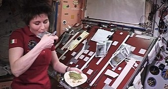 Astronaut demonstrates cooking aboard the International Space Station