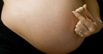 Pregnant women who eat peanuts may put their children at increased risk for peanut allergy.