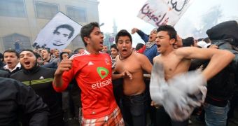 Riots in Egypt prompt curfews in the cities of Port Said, Ismailia and Suez