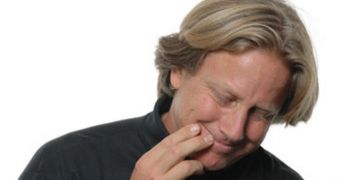 Psychologist Dacher Keltner, a coauthor of the study, demonstrates a typical gesture of embarrassment