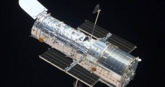 The Hubble Space Telescope, photographed by the departing space shuttle Atlantis, after the successful completion of repairs