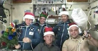 Wearing festive holiday hats, the Expedition 22 crew speaks with officials from Russia, Japan and the United States. Image taken after last night's dock