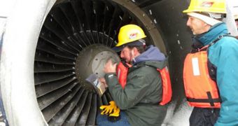 Experts collect samples from the engines of the plane that was forced to land in the Hudson River in January, after hitting a flock of birds