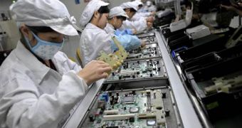 Foxconn workers assembling computers