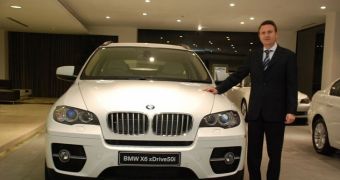 Peter Kronschnabl, president of BMW India at the launch of BMW X6 - picture used by scammers
