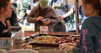 Food stand vendors cooking and selling sausages in Seattle, Washington