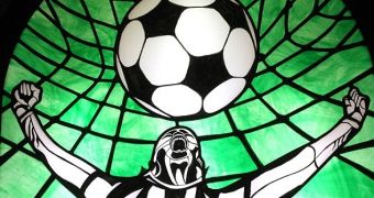Fanatic Puts Up Stained Glass Window with Soccer Scenes