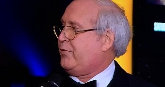 Chevy Chase talks to Carson Daly on the red carpet for the Saturday Night Live 40th anniversary special