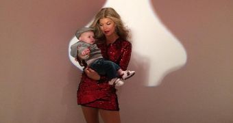 Fergie poses with her son with husband Josh Duhamel